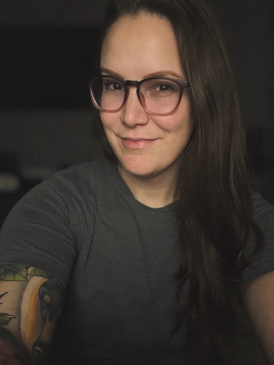 Portrait of a woman wearing a black Grapple Like a Girl T-shirt