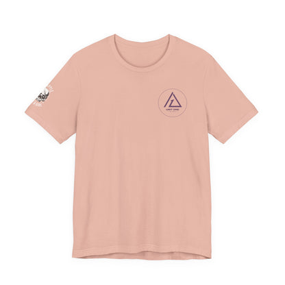 Light pink T-shirt with Unit One Jiu-Jitsu chest logo and Grapple Like a Girl sleeve graphic